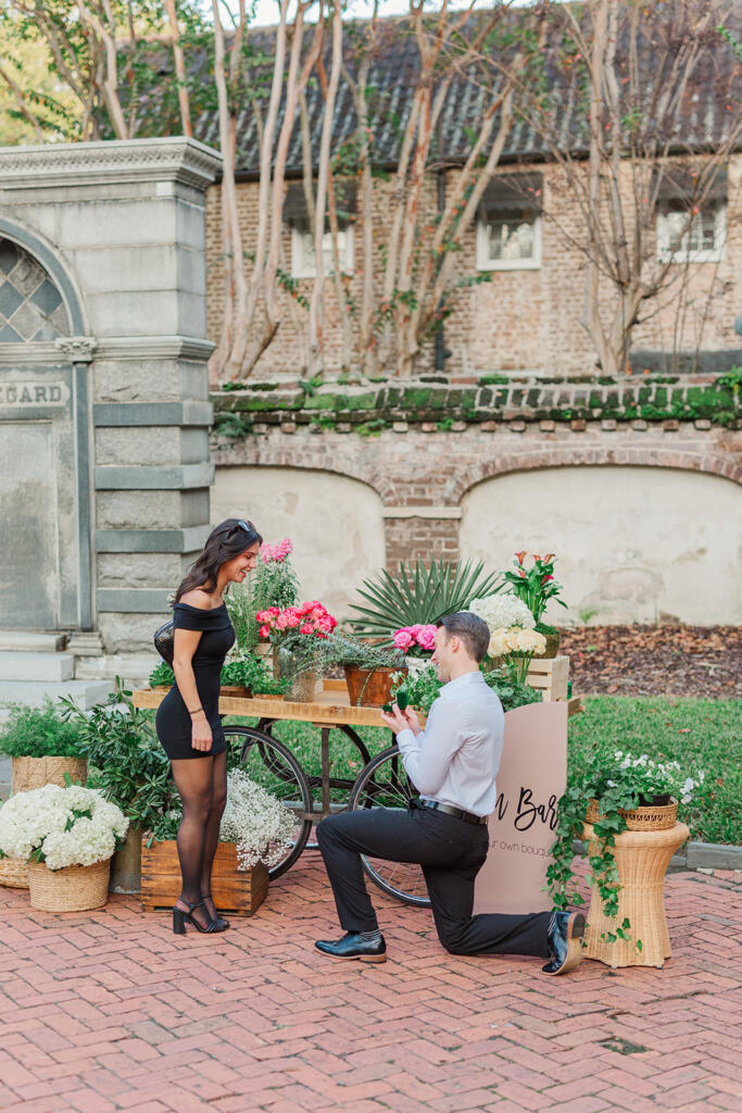 best place to propose in Charleston, flower cart proposal, Charleston flower cart, charleston floral cart, floral cart proposal, bicycle table proposal, unique proposal ideas, Charleston Premier Luxury Proposal Location, charleston proposal planner, Charleston south carolina, proposal photography, under the oaks proposal, laura and rachel photography, charleston proposal photographer, where to propose in Charleston, best places to pop the question in chs, best places to pop the question in Charleston, Best Charleston Proposal Location Ideas, Proposal Locations in Charleston SC, THE BEST PLACES TO PROPOSE AROUND CHARLESTON SOUTH CAROLINA, washington square proposal, charleston wedding Photographer, charleston engagement session, charleston engagement photographer, adorn charleston, custom champagne bottle