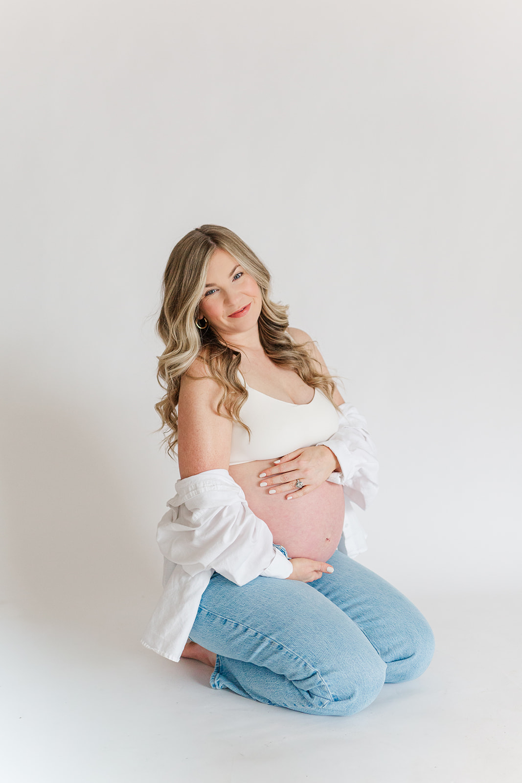 Charleston studio maternity photography featuring soft natural light and neutral styling | Laura and Rachel Photography