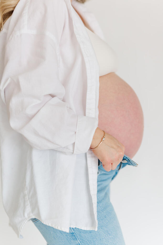 Charleston studio maternity photography featuring soft natural light and neutral styling | Laura and Rachel Photography