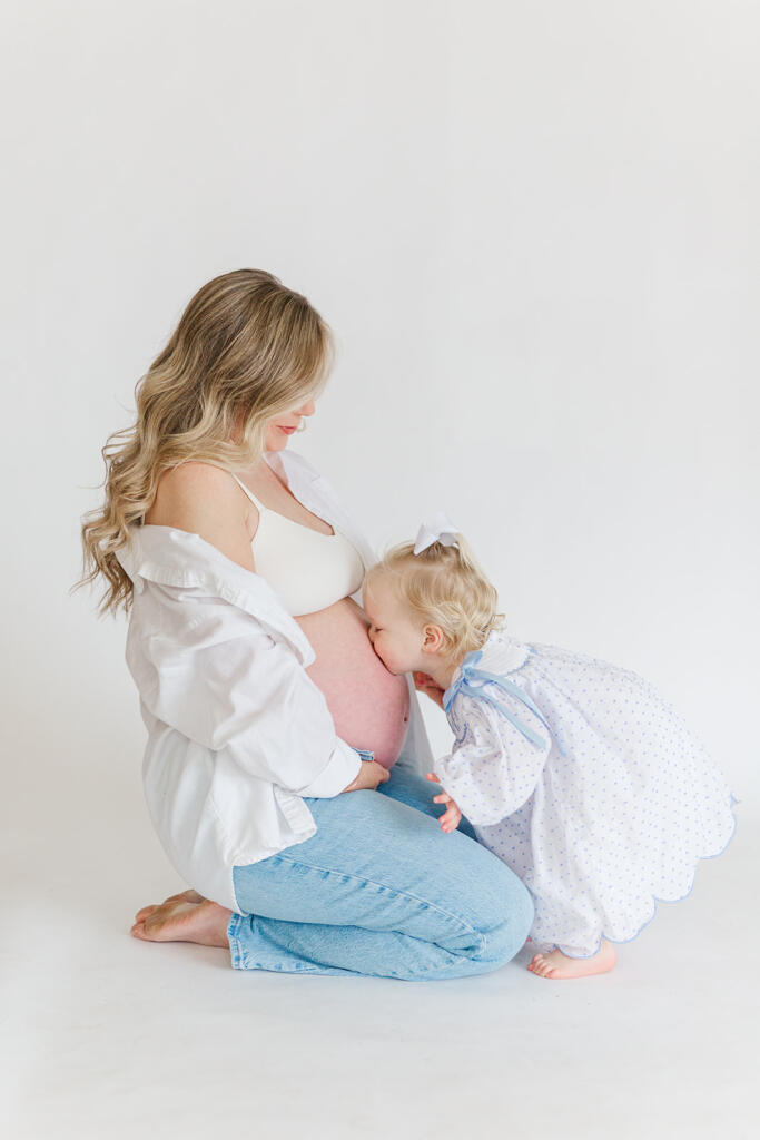Charleston studio maternity photography featuring soft natural light and neutral styling | Laura and Rachel Photography