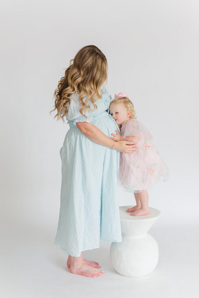 Charleston studio maternity photography featuring soft natural light and neutral styling | Laura and Rachel Photography