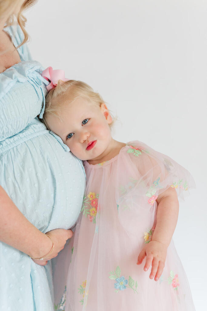 Charleston studio maternity photography featuring soft natural light and neutral styling | Laura and Rachel Photography