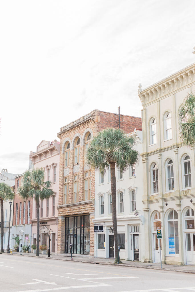 Sunset view over downtown Charleston from a rooftop bar, Romantic candlelit dinner at a Charleston restaurant, Outdoor courtyard dining in downtown Charleston, Champagne toast after a proposal in Charleston SC, Engagement celebration dinner in downtown Charleston, Girls’ weekend brunch in Charleston South Carolina, Charleston proposal photographer, Charleston engagement photographer, Charleston wedding photographer, Laura and Rachel Photography,