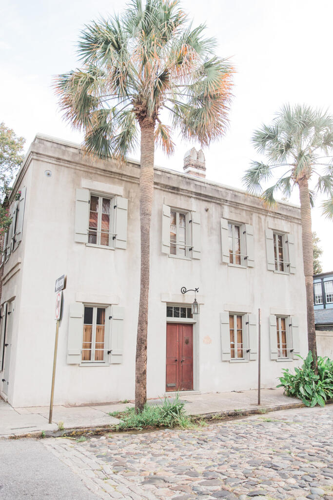 Sunset view over downtown Charleston from a rooftop bar, Romantic candlelit dinner at a Charleston restaurant, Outdoor courtyard dining in downtown Charleston, Champagne toast after a proposal in Charleston SC, Engagement celebration dinner in downtown Charleston, Girls’ weekend brunch in Charleston South Carolina, Charleston proposal photographer, Charleston engagement photographer, Charleston wedding photographer, Laura and Rachel Photography,
