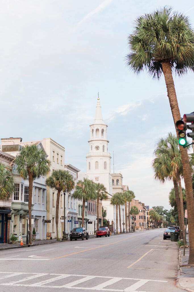 Sunset view over downtown Charleston from a rooftop bar, Romantic candlelit dinner at a Charleston restaurant, Outdoor courtyard dining in downtown Charleston, Champagne toast after a proposal in Charleston SC, Engagement celebration dinner in downtown Charleston, Girls’ weekend brunch in Charleston South Carolina, Charleston proposal photographer, Charleston engagement photographer, Charleston wedding photographer, Laura and Rachel Photography,