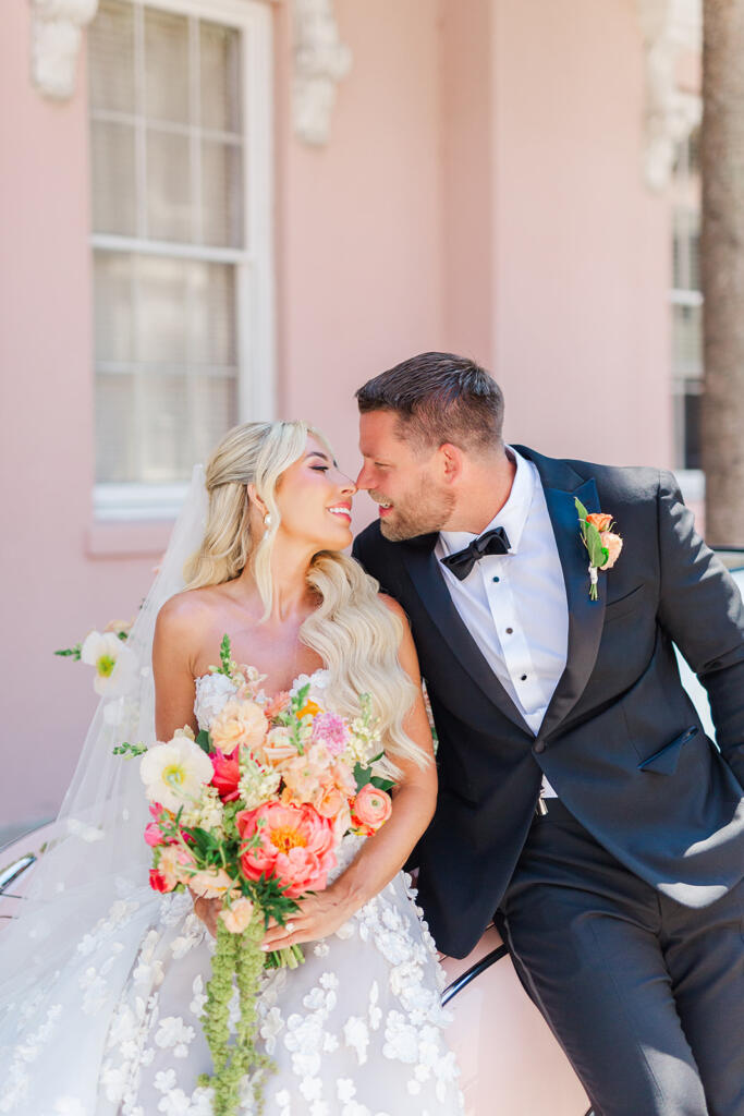 Bride arriving in the Pink Figgy adorned in florals by Forever Flowers Charleston for her Hotel Emeline wedding - Laura and Rachel Photography www.lauraandrachel.com